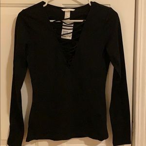 Black long sleeve with a v-line strap